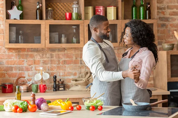 Black lovely married couple dancing in kitchen — Stock Photo, Image