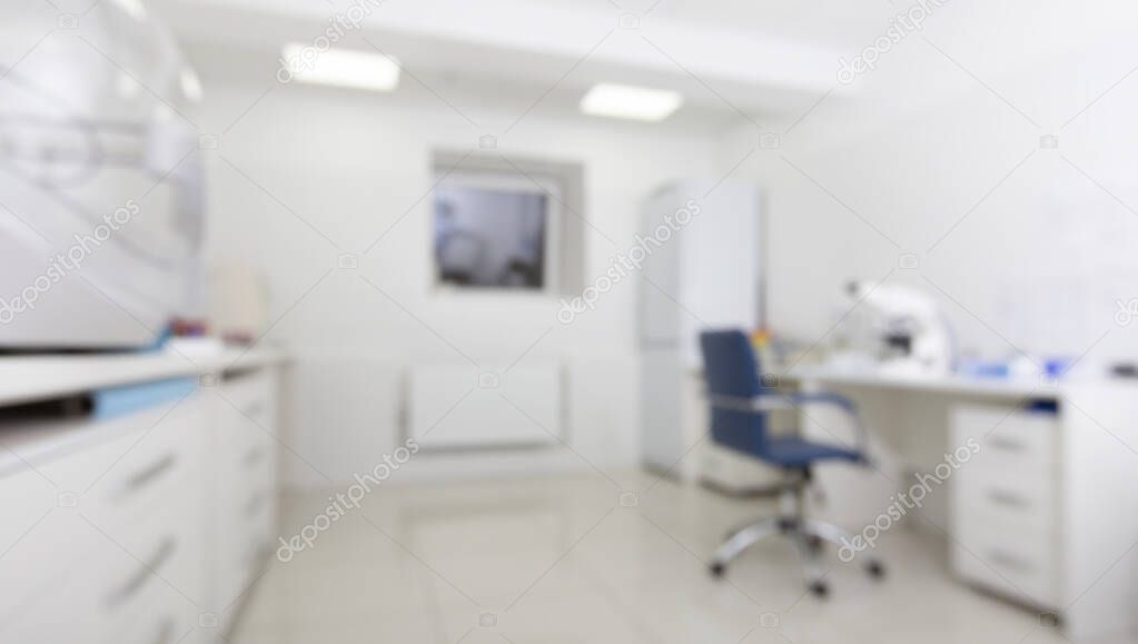 Blurred medical laboratory with microscope and other modern equipment