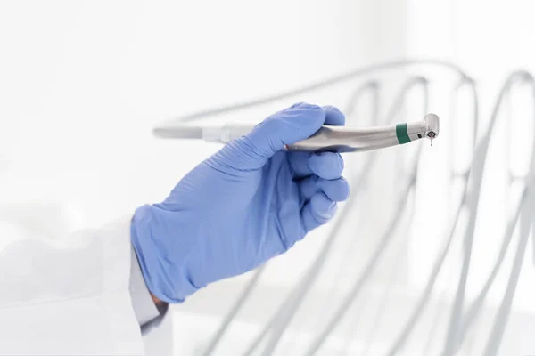 Close up image of dentist hand holding steel dental drill — Stock Photo, Image