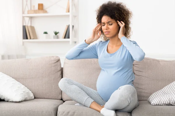 Tired pregnant lady having migraine, touching head — Stock Photo, Image
