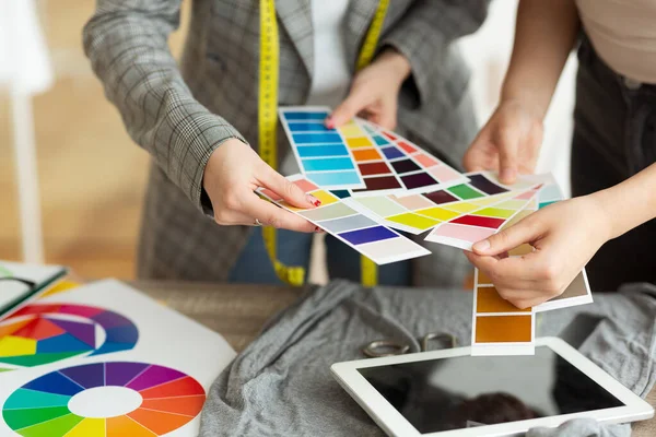 Fashion designer choosing color samples in atelier — Stock Photo, Image