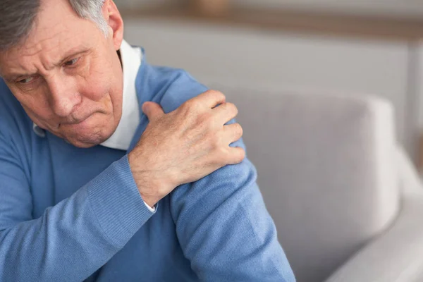 Senior Gentleman Having Shoulder Pain Sitting On Couch — Stock Photo, Image