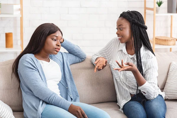 Young afro girl tired of her talkative friend — Stock Photo, Image