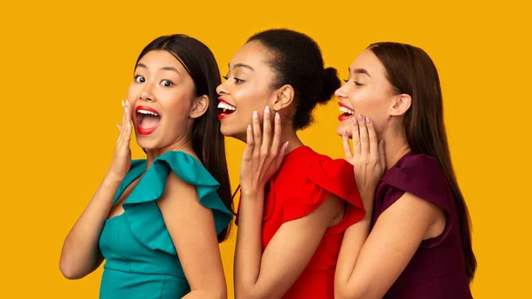 Three Diverse Models Sharing Secrets Standing Over Yellow Background, Panorama — ストック写真