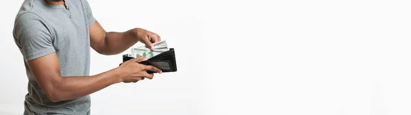 African man showing full wallet with dollar banknotes — Stock Photo, Image