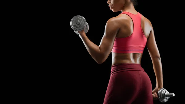Cropped photo of athletic woman exercising with dumbbells — ストック写真