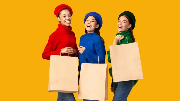 Three Happy Buyers Women Standing with Blank Shopping Bags, Studio — стокове фото