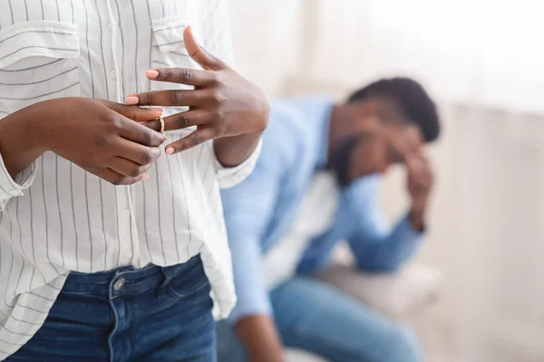 Unrecognizable black woman removing wedding ring from finger, divorcing with husband — Stock Photo, Image