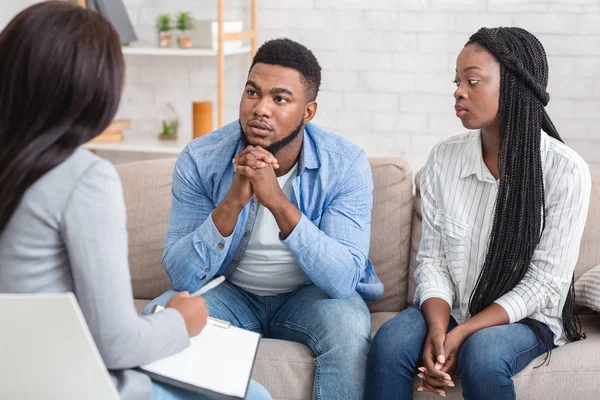 Couple Listening To Counselors Advice Sitting On Sofa During Therapy Session — Stock Photo, Image