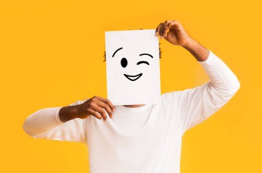 Afro guy holding paper with positive emoji clipart