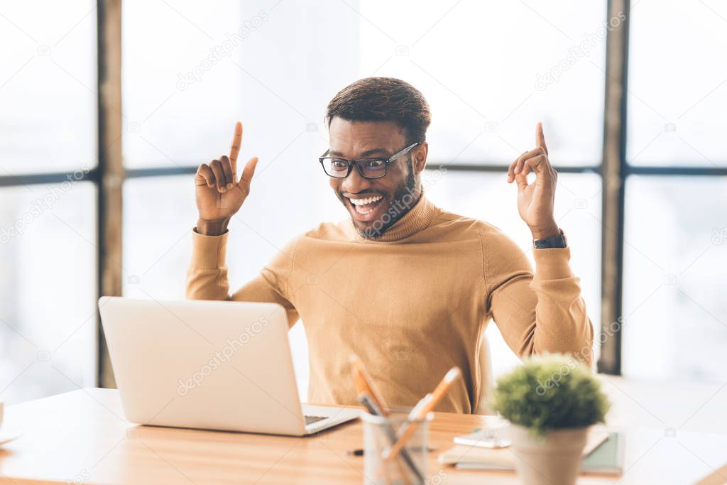 Overjoyed african american guy celebrating his win