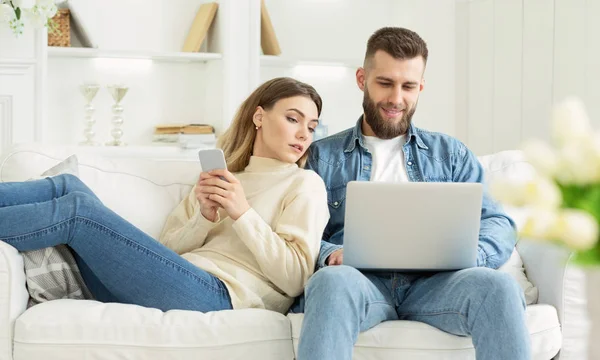 Marital problem. Interested woman looking at husbands laptop — Stock Photo, Image