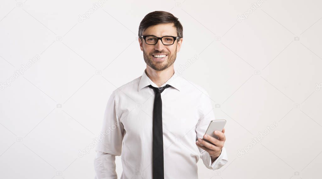 Smiling Man Using Mobile Phone Standing Over White Background, Panorama