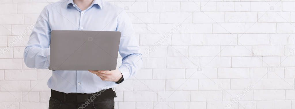 Employee using modern laptop at work, empty space