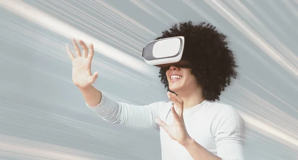 Excited afro guy having virtual reality glasses experience — Stock Photo, Image