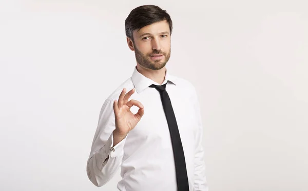 Confident Businessman Gesturing Okay Standing Over White Studio Background — Stock Photo, Image