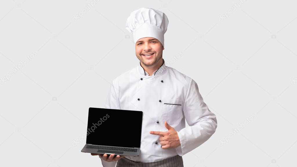 Chef Man Holding Laptop With Blank Screen Standing, White Background