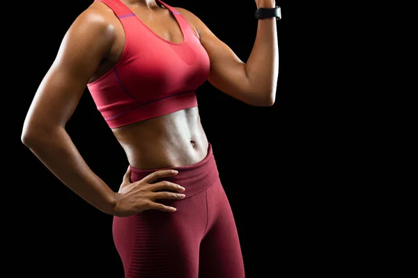 Αθλητικό σώμα του γυναικείου μοντέλου φυσικής κατάστασης σε μαύρο φόντο — Φωτογραφία Αρχείου