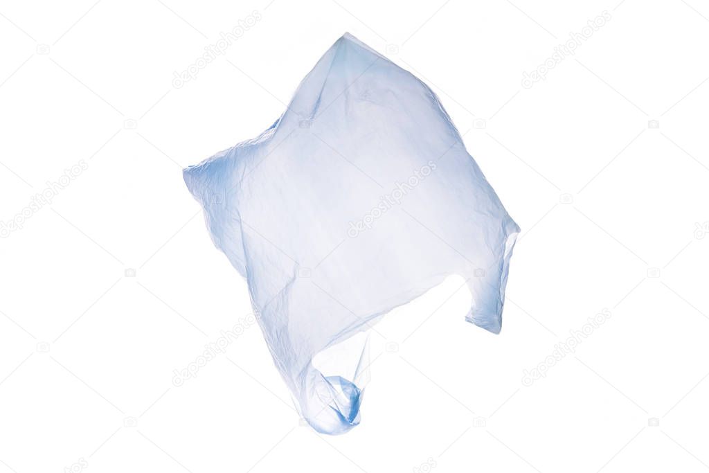 White plastic shopping bag flying over white background
