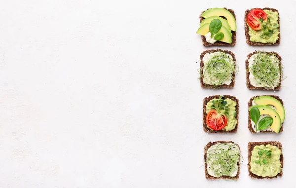 Sandwiches with avocado, tofu cheese and microgreen — Stock Photo, Image