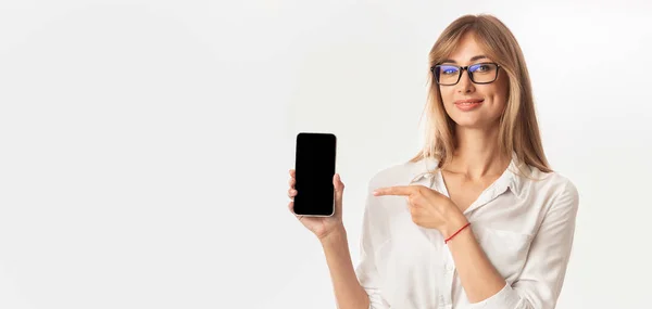 Lady Holding Phone Pointing Finger At Screen, White Background, Mockup — Stock Photo, Image