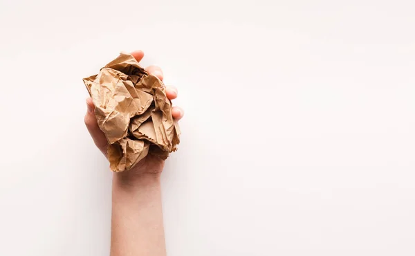 Hand holding lump of brown paper preparing for recycling — Stock Photo, Image