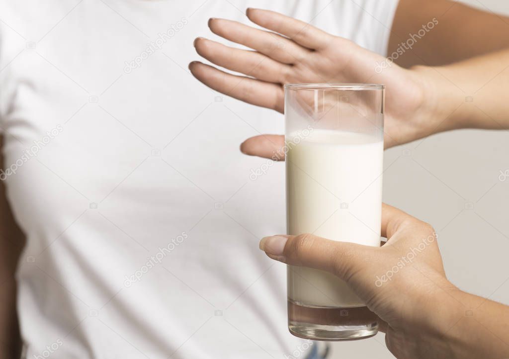 Unrecognizable Woman Gesturing No To Milk Standing In Studio, Cropped