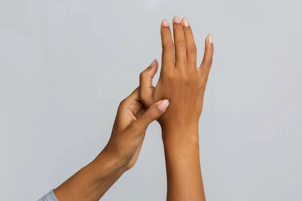 Cropped of black woman massaging her hand joints — Stok fotoğraf