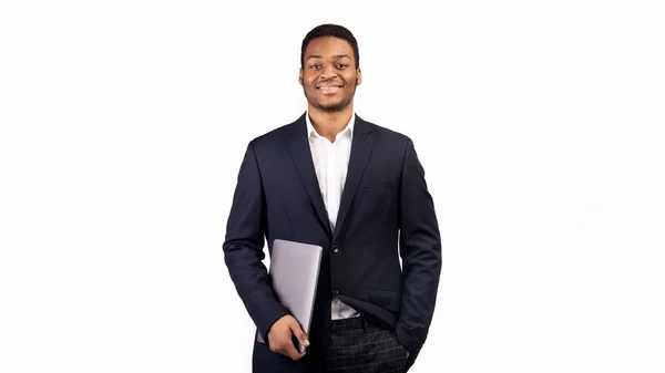 Handsome afro guy holding laptop on white background — Stock Photo, Image