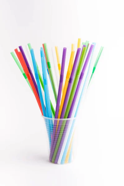 Plastic straws for drinking inside plastic cup isolated on white — 스톡 사진