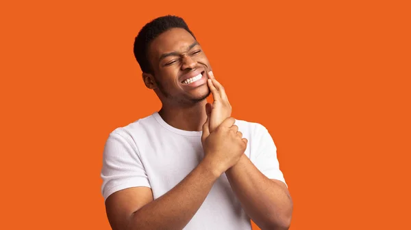 Closeup portrait of handsome afro man with tooth ache — Stock Photo, Image