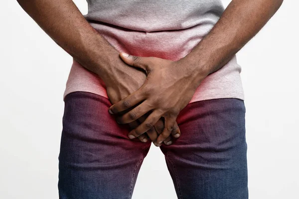 Black guy covering his genitals with both hands — 스톡 사진
