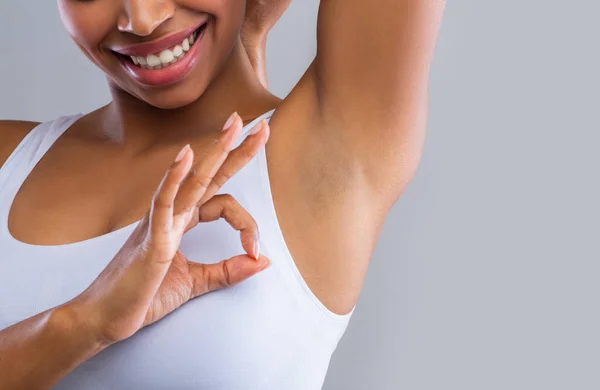 Cropped of woman looking at shaved armpit, showing okay gesture — 스톡 사진