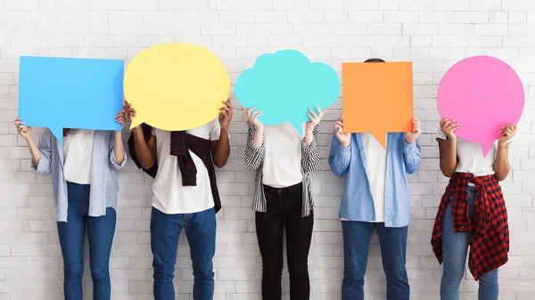 Everyone has own opinion. Teens holding empty speech bubbles — Stock Photo, Image