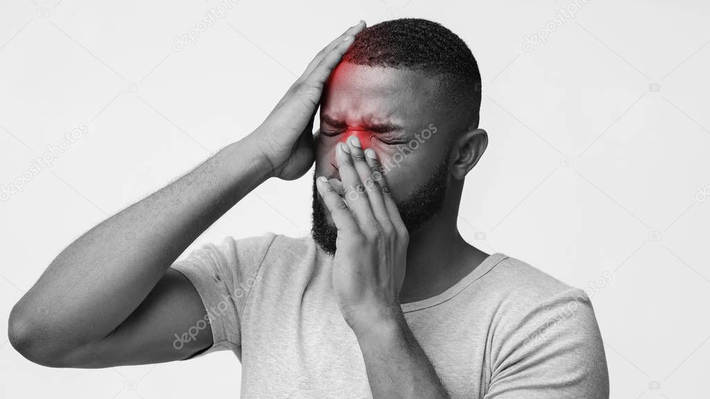 Black and white photo of man suffering from sinusitis