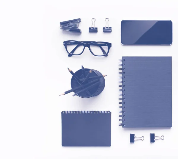 Ordered blue supplies and blank space on clipboard on workplace — Stock Photo, Image