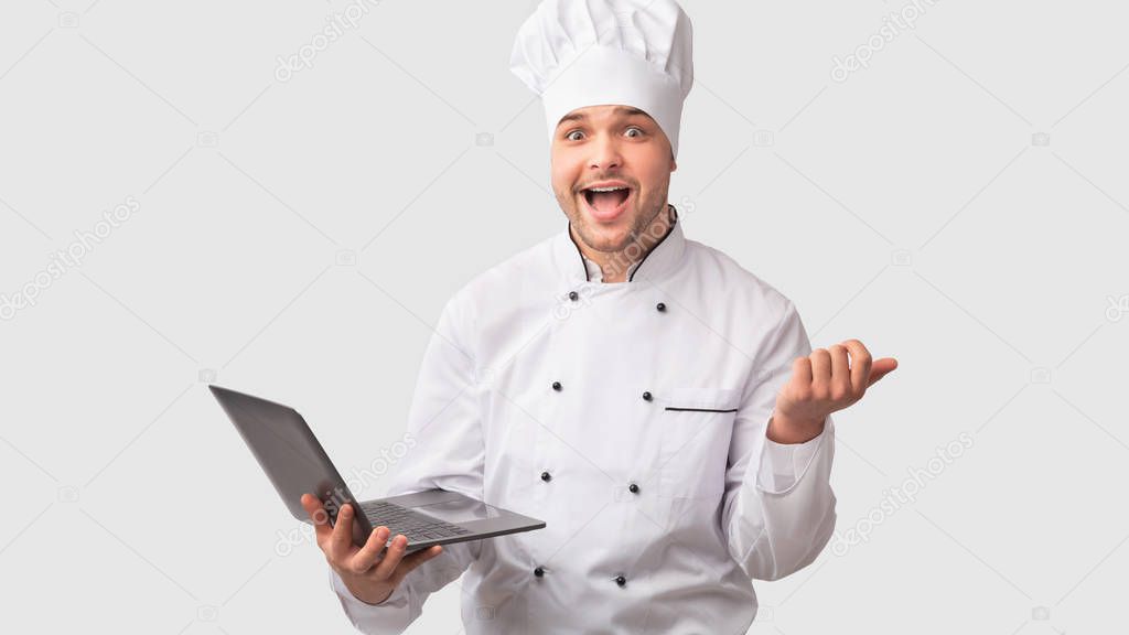 Cook Man Holding Laptop Standing Over White Studio Background, Panorama