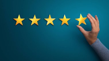 Business woman holding five star to increase rating of company