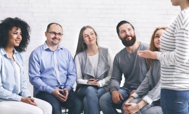 Patients enjoying achievement of addicted woman at therapy