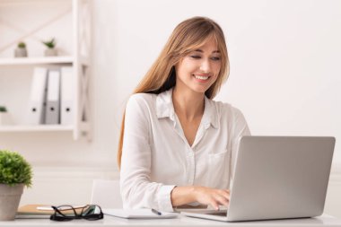 Successful Entrepreneur Woman Using Laptop In Modern Office
