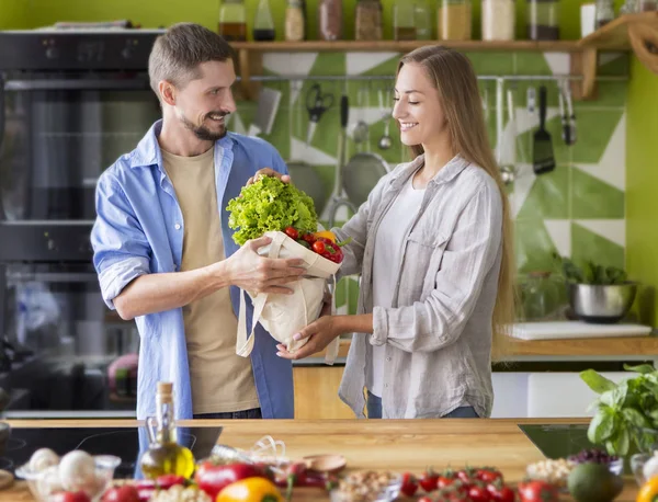 Young overjoyed pair making first vegan breakfast dishes — Stockfoto