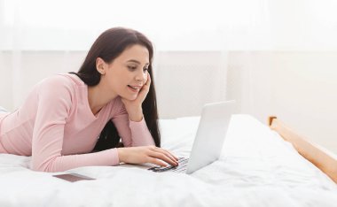 Young interested woman browsing for work opportunities online