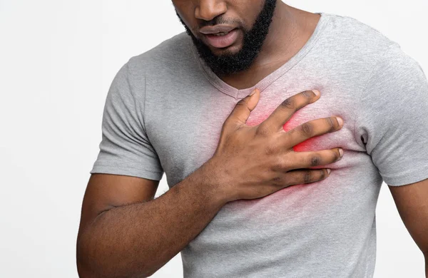 Young man suffering from severe chest pain — Stock Photo, Image