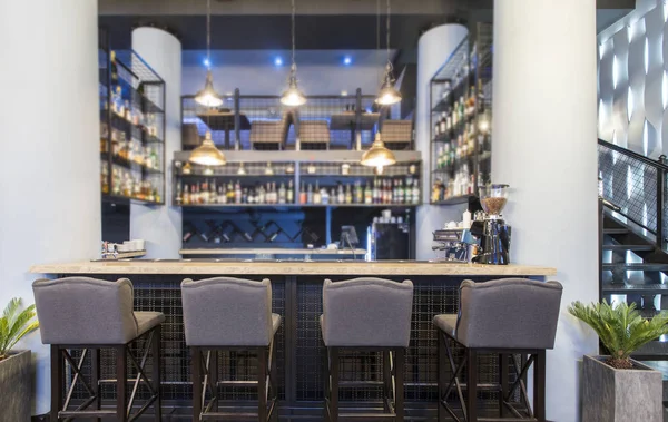 Half-lighted hall in a loft style in urban cafe with open bar counter — 스톡 사진