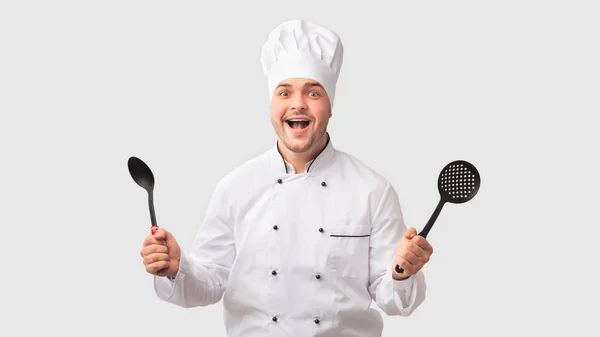 Excited Chef Man Holding Ladle And Slotted Spoon, White Background — 스톡 사진