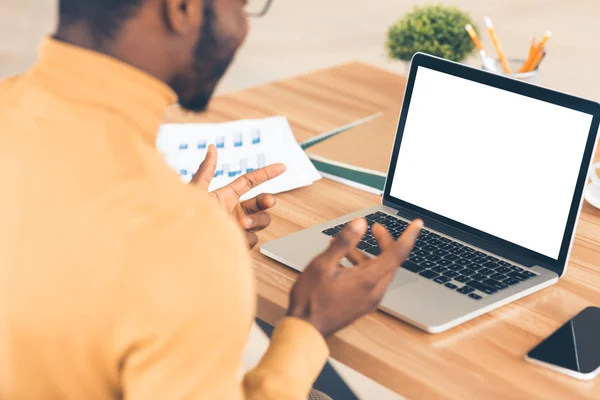 Afro businessman looking at white blank screen — 스톡 사진