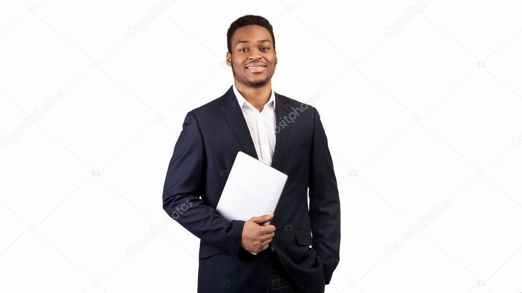 Confident black man holding laptop on white background