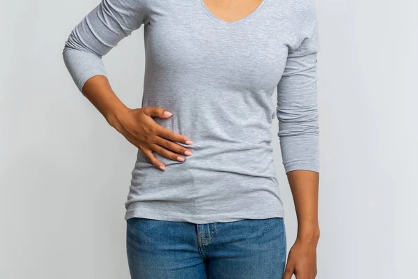 African woman suffering from liver pain, cropped — Stock Photo, Image