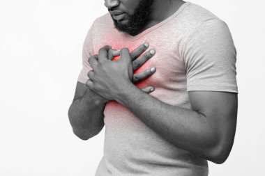 Black young man suffering from acid reflux or heartburn clipart