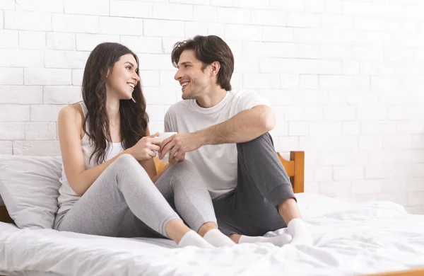 Happy newlyweds enjoying first married morning in bed — 스톡 사진